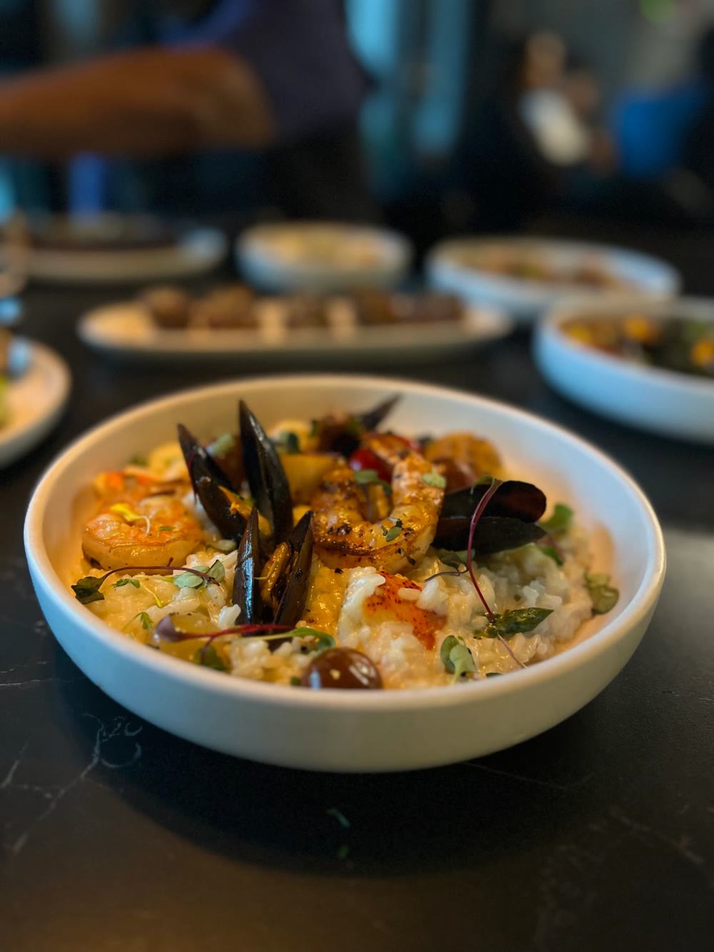 Seafood risotto with mussels, shrimp and scallops in a lobster broth